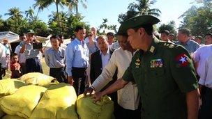Valerie Amos is shown food supplies at the Rakhine camp on Myebon