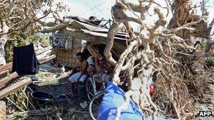 People in a makeshift shelter in New Bataan, 12 December 2012