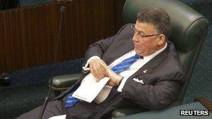 McKeeva Bush listens to speeches during the session called to debate a motion of no confidence in him