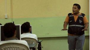 Police officer giving a talk in a Guayquil high schools