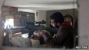 A Free Syrian Army sniper in Aleppo, 21 December 2012