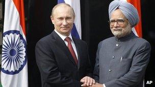 Russian President Vladimir Putin, left, shakes hands with Indian Prime Minister Manmohan Singh, right, before a meeting at his residence in New Delhi, India, Monday, December 24, 2012.