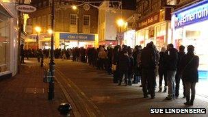 Shoppers queuing up outside Next in Kingston-upon-Thames; picture taken by BBC viewer Sue Lindenberg