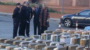 Madrid regional government delagate Cristina Cifuentes (right) and the chief of Spain's national police force, Ignacio Cosido (2nd right) look at part of a haul of hashish and marijuana in Madrid, Wednesday 26 Dec 2012
