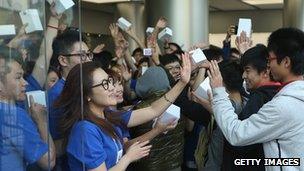 Customers entering an Apple store in China