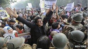 Demonstrators shout slogans as they are surrounded by the police during a protest rally in New Delhi