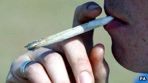 A man smoking a cannabis joint