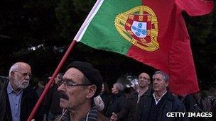 Portuguese protester holding flag