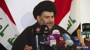 Iraqi Shia cleric Moqtada al-Sadr speaks during a news conference in Najaf