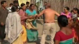 Women strip rape suspect Bikram Singh Brahma in Santipur, Assam, India, 3 January (video grab from Indian TV)