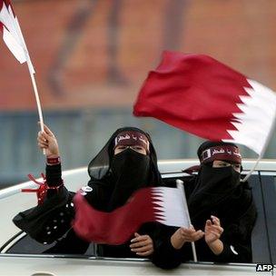 Qatari women celebrate their country's successful bid to host the 2022 World Cup