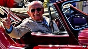 Graham Furley in a vintage Jaguar at Staverton airfield