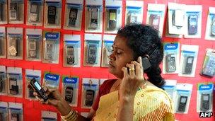 A woman talks on a mobile phone in India