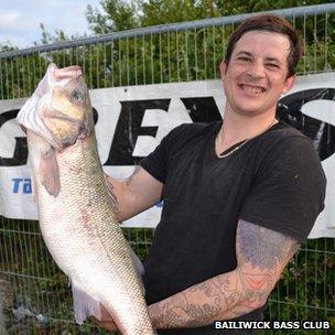 Matthew Clark with stolen fish. Pic: Bailiwick Bass Club