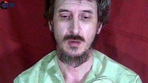 A file handout still frame released on October 4, 2012 by the SITE Monitoring Service shows French secret agent Denis Allex held hostage in Somalia