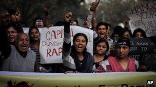Protestors shout slogans while demanding capital punishment for rapists in Delhi.