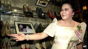 Imelda Marcos with some of her shoes on display at a museum in Marikina City (Feb 2001)