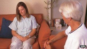 Therapist talking to a patient