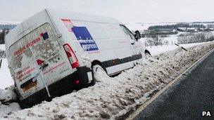 Van lays in the snow after coming off the Pickering to Whitby road near Lockton, North Yorkshire