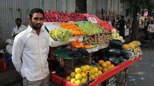 Street fruit seller with his cart in Mumbai