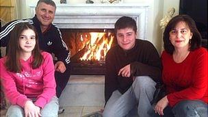 The Smirli family around their fire