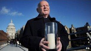 Holocaust survivor Ben Helfgott, with a candle on Millennium Bridge