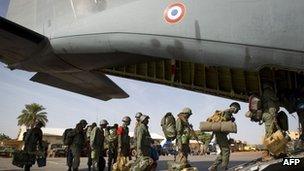 Malian troops boarding a French military transport plane