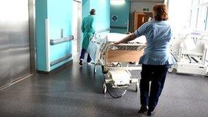Nurse pushing hospital bed