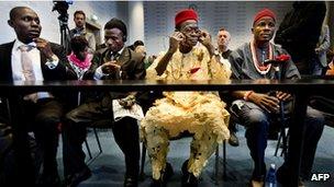 Nigerian farmers (L to R) Alali Efanga, Friday Alfred Akpan-Ikot Ada Udo, Chief Fidelis A Oguru and Oruma en Eric Dooh sit in court on 11 October 2012 as part of their proceedings against oil firm Shell