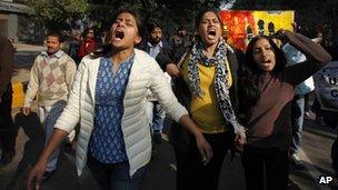 ndian women shout slogans during a protest march against gender discrimination and sexual violence in New Delhi, India, Saturday, Jan. 26, 2013.