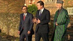 David Cameron (C) with Afghan President Hamid Karzai (R) and Pakistani President Asif Ali Zardari at Chequers, north of London, 4 Feb