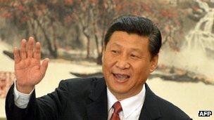 Xi Jinping emerges as head of the Politburo Standing Committee of the Communist Party - and the new leader of the country - at the Great Hall of the People in Beijing on 15 November 2012