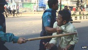 Police with suspected Jamaat-e-Islami supporter in Dhaka - 6 February