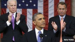 US House Speaker John Boehner (R-OH) and Vice President Joe Biden (L) stand to applaud as President Barack Obama delivers his State of the Union speech