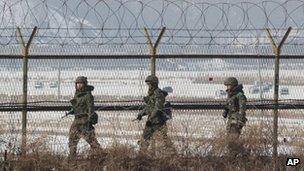 South Korean soldiers patrol the DMZ on 14 February 2013