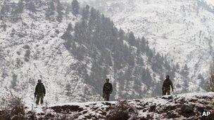 Indian army soldiers patrol near the Line of Control (LOC), the line that divides Kashmir between India and Pakistan, in Silikot some 130 Kilometers (81 miles) north of Srinagar, India, Thursday, Jan. 17, 2013.
