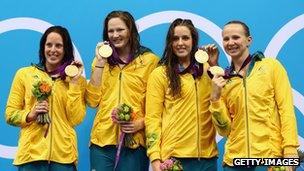 Australia's women's 4 x 100m freestyle relay team celebrate their gold medals on 28 July 2012