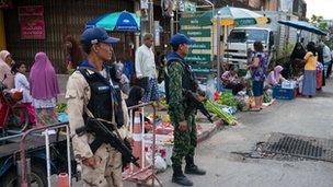 Soldiers at Narathiwat Market in the country's south