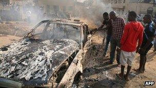 Wreckage of a car bomb outside Nigeria's capital, Abuja on 25 December 2011