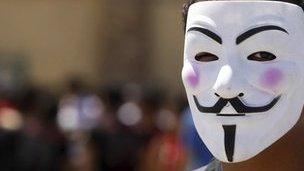 Man wearing Anonymous mask