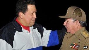 President Raul Castro (right) receives Venezuela's President Hugo Chavez in December 2012