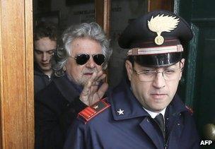 Beppe Grillo leaves a polling station after casting his ballot in Saint Ilario near Genoa, 25 February