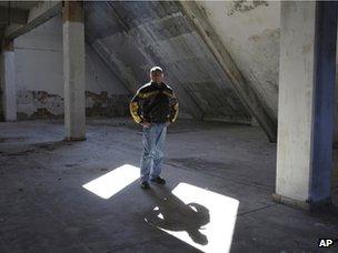 A man stands inside an abandoned factory in Drvar (4 March 2013)