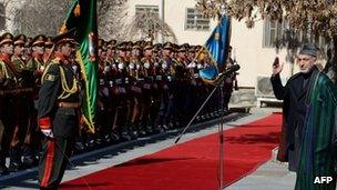 President Hamid Karzai inspects a guard of honour after his arrival for the opening session of Parliament in Kabul on 6 March 2013