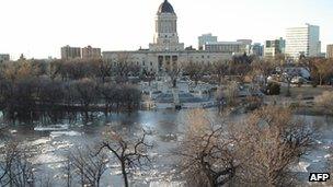 The Assiniboine River in Winnipeg overflows its banks 7 April 2006