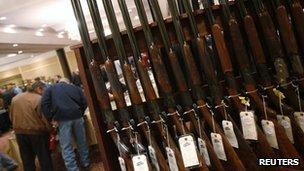 A row of shotguns are seen during the East Coast Fine Arms Show in Stamford, Connecticut, 5 January 2013