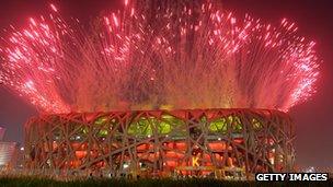 Fireworks explode over Bird's Nest during the Opening Ceremony of the 2008 Beijing Summer Olympics on 8 August 2008