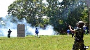 Police fire tear gas at supporters of Former Foreign affairs minister during a demonstration in Blantyre on March 11, 2013.