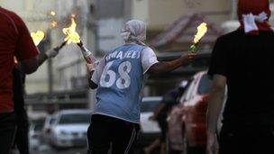 Young Bahrainis retaliate with Molotovs