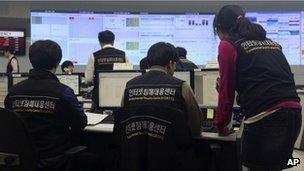 Employees of Korea Internet Security Center work after computer networks at two major South Korean banks and three top TV broadcasters went into shutdown mode en masse, at a monitoring room in Seoul, South Korea, Wednesday, March 20, 2013.